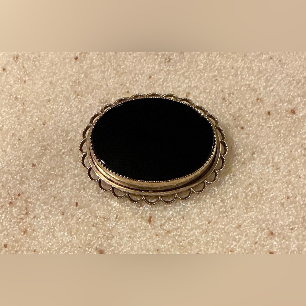 Black and Gold Oval Brooch with Ornate Scalloped Edge
